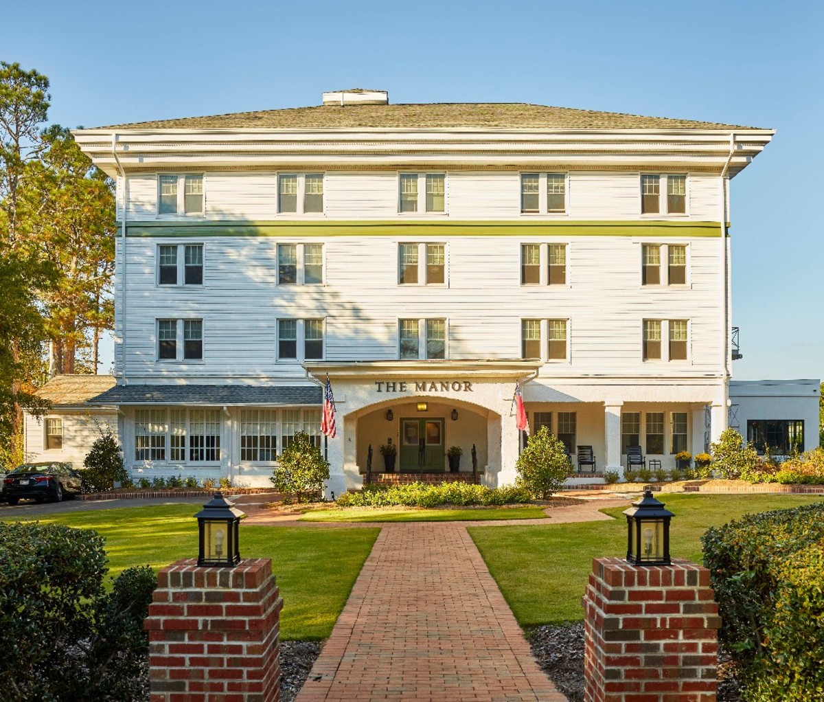 Front exterior image of The Manor, Pinehurst's oldest hotel