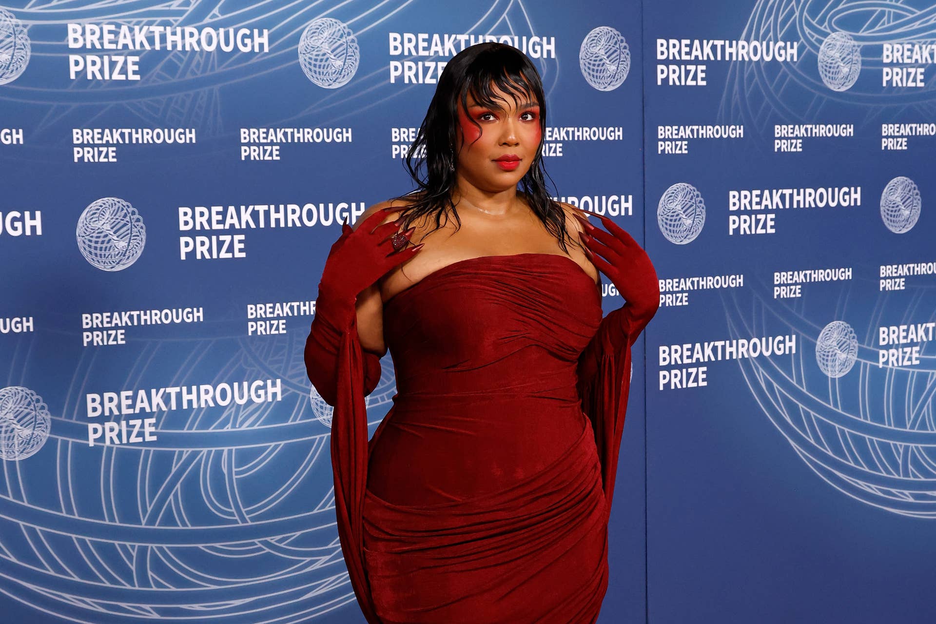 Lizzo Turns Heads in Sheer Dress For 'SNL' Performance - Men's Journal
