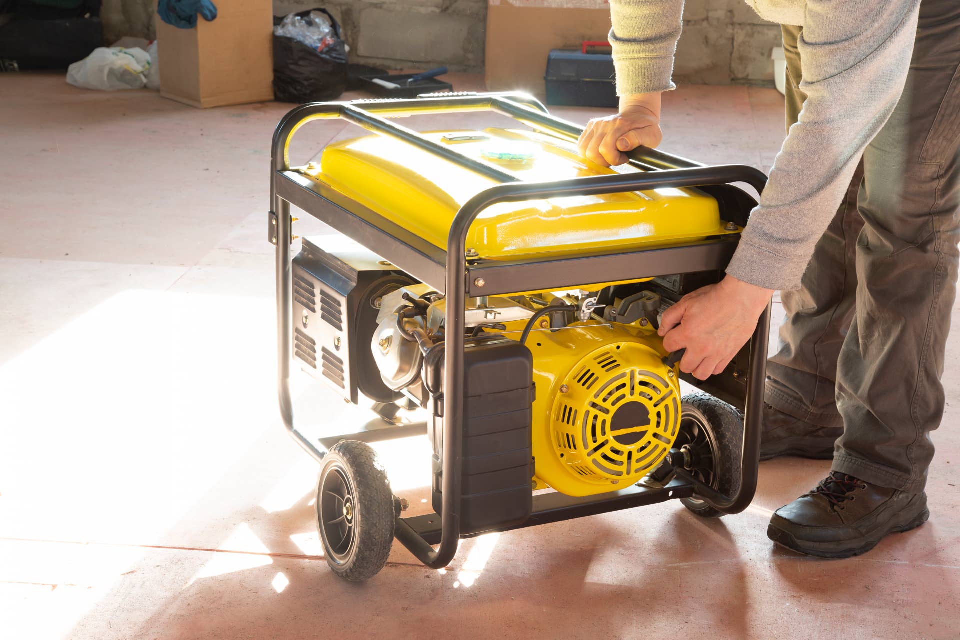 Man Starting Generator This Generator Refueling Mistake Could Be Catastrophic - Men's Journal