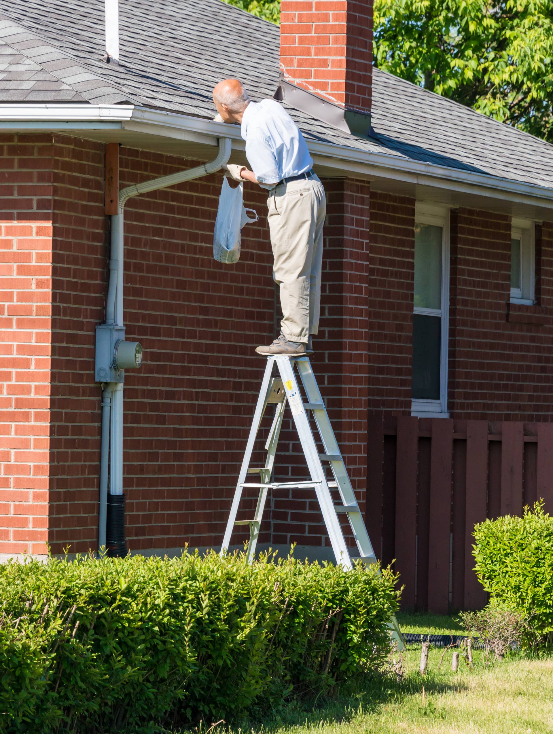 The Rake Movir Roofer Warns Against Cleaning Gutters With a Rake - Men's Journal