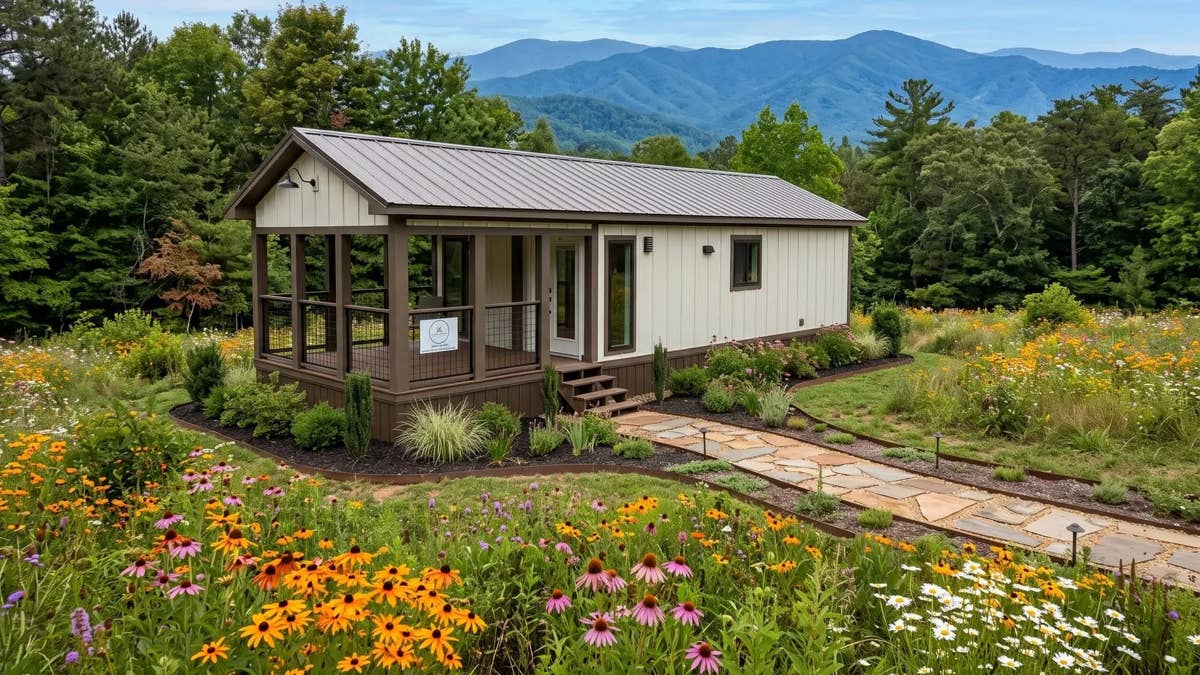 This $115K Tiny Home Has a Front Porch, a Fireplace, and a Surprise Underneath