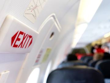 Video Shows Passenger Attempting to Open Plane
