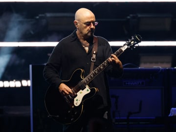 Oasis Guitarist Leaves Tour Amid Cancer… 