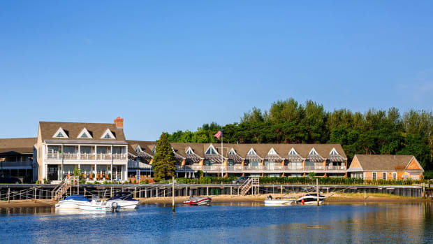 View of Baron's Cove hotel on East End of Long Island from water wth boats docked