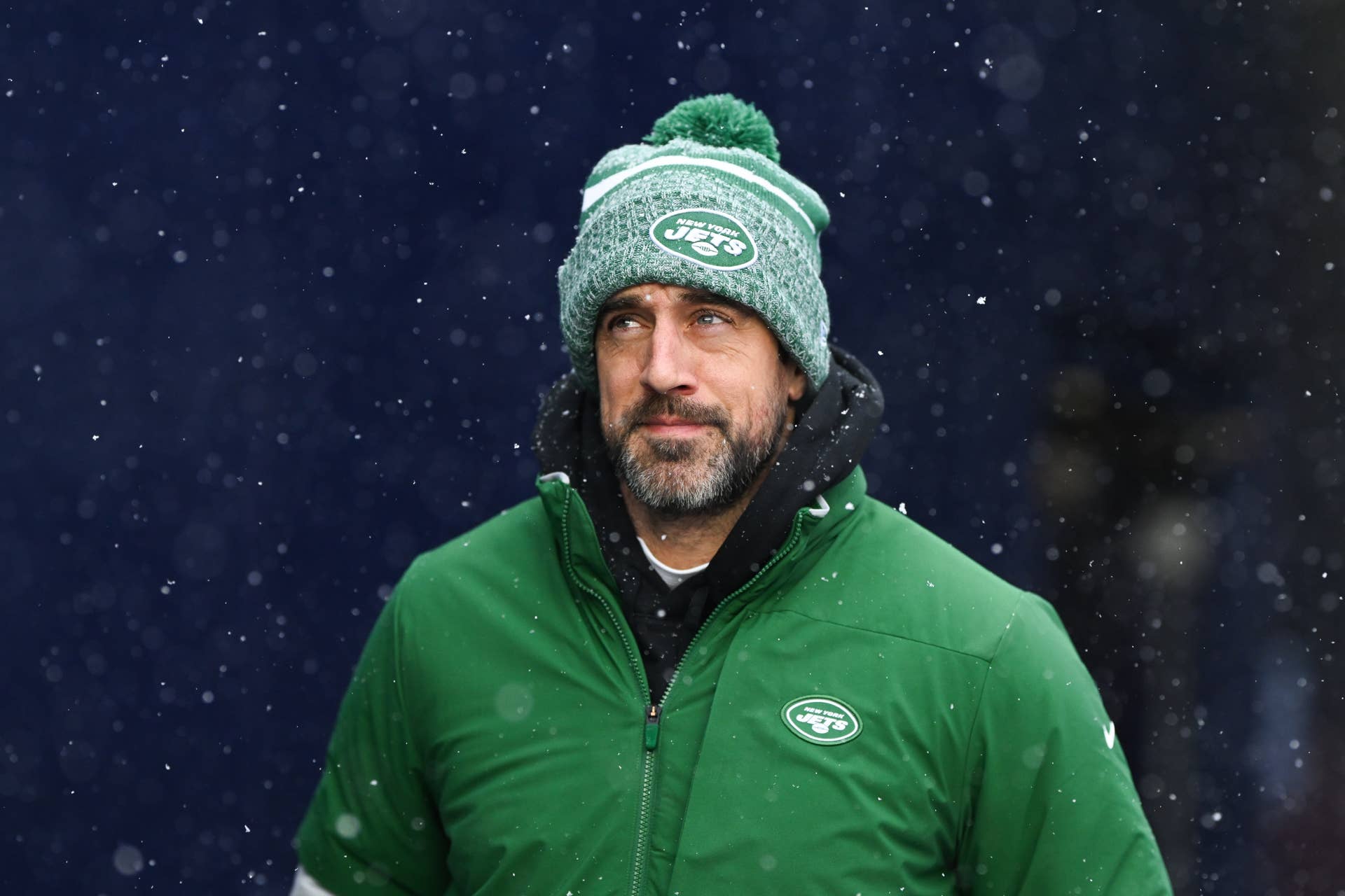 Aaron Rodgers #8 of the New York Jets runs onto the field prior to the start of the game against the New England Patriots at Gillette Stadium on January 7, 2024 in Foxborough, Massachusetts.