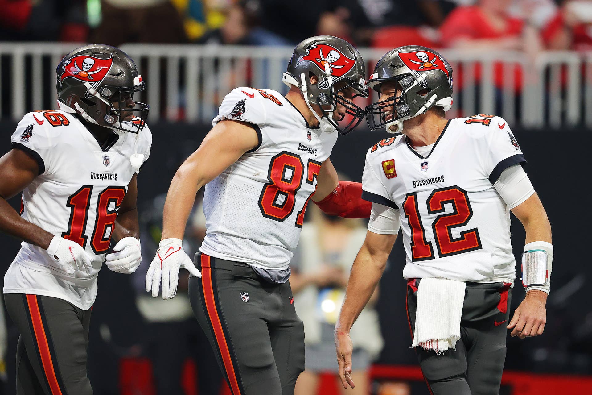 ATLANTA, GEORGIA - DECEMBER 05: Rob Gronkowski #87 of the Tampa Bay Buccaneers celebrates his touchdown against the Atlanta Falcons with teammate Tom Brady #12 during the second quarter at Mercedes-Benz Stadium on December 05, 2021 in Atlanta, Georgia. (Photo by Kevin C. Cox/Getty Images)