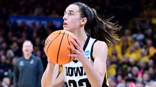 Iowa guard Caitlin Clark attempts a three-point shot during the West Virginia Mountaineers game versus the Iowa Hawkeyes in the second round of the NCAA Division I Women's Championship on March 25, 2024.