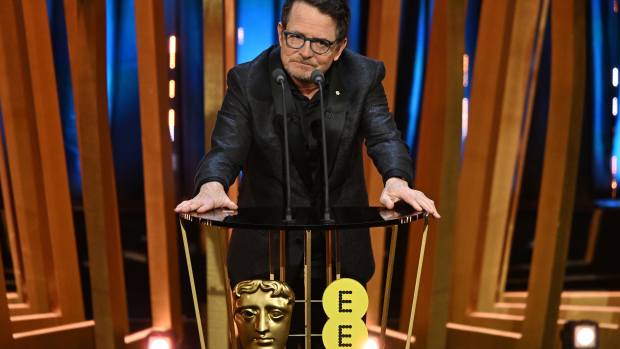 LONDON, ENGLAND - FEBRUARY 18: Michael J Fox presents the Best Film Award on stage during the EE BAFTA Film Awards 2024 at The Royal Festival Hall on February 18, 2024 in London, England. (Photo by Kate Green/BAFTA/Getty Images for BAFTA)