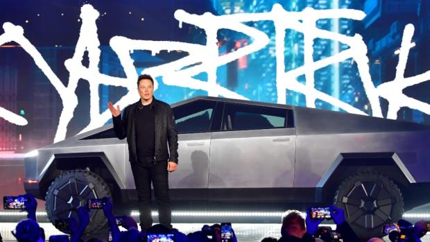 Tesla co-founder and CEO Elon Musk introduces the newly unveiled all-electric battery-powered Tesla Cybertruck at Tesla Design Center in Hawthorne, California on November 21, 2019.