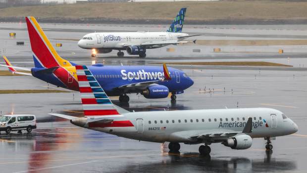 An Airbus A320 passengers aircraft of JetBlue airlines arriving from Tampa is pictured while a Boeing 737 of Southwest airlines arrived from Atlanta and an Airbus A319 arrived from Saint Louis are seen at La Guardia Airport on January 9, 2024. (Photo by Charly TRIBALLEAU / AFP) (Photo by CHARLY TRIBALLEAU/AFP via Getty Images)