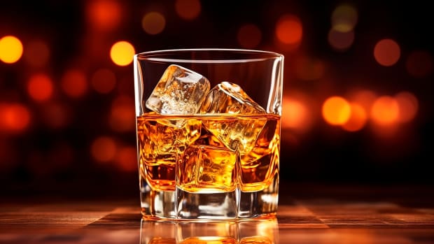 Whiskey with ice cubes in glass 
