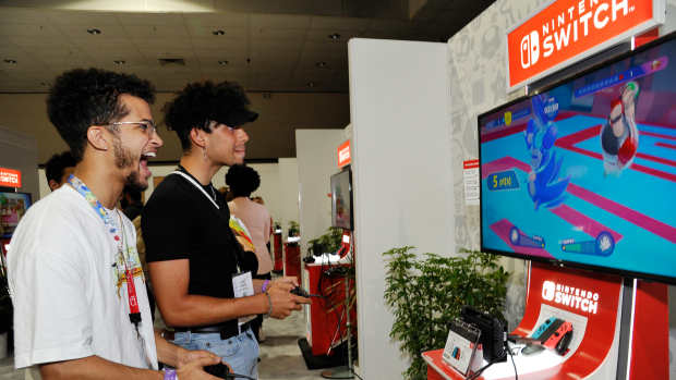 Jordan Fisher (L) and Cory Fisher check out 'Mario & Sonic at The Olympic Games Tokyo 2020' for the Nintendo Switch system during the 2019 E3 Gaming Convention at the Los Angeles Convention Center on June 11, 2019 in Los Angeles, California.