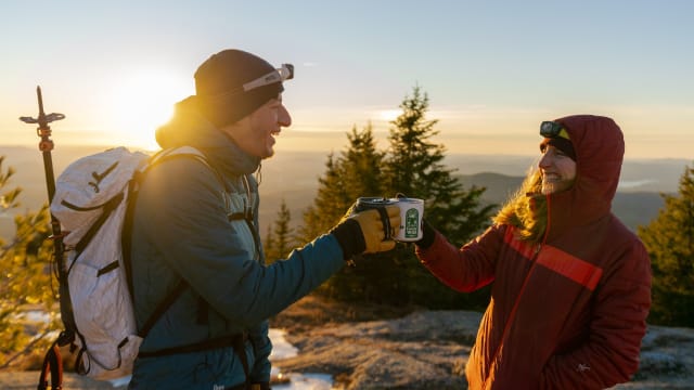 Two thru-hikers on the trail wearing Ibex Wool Aire Hoodies