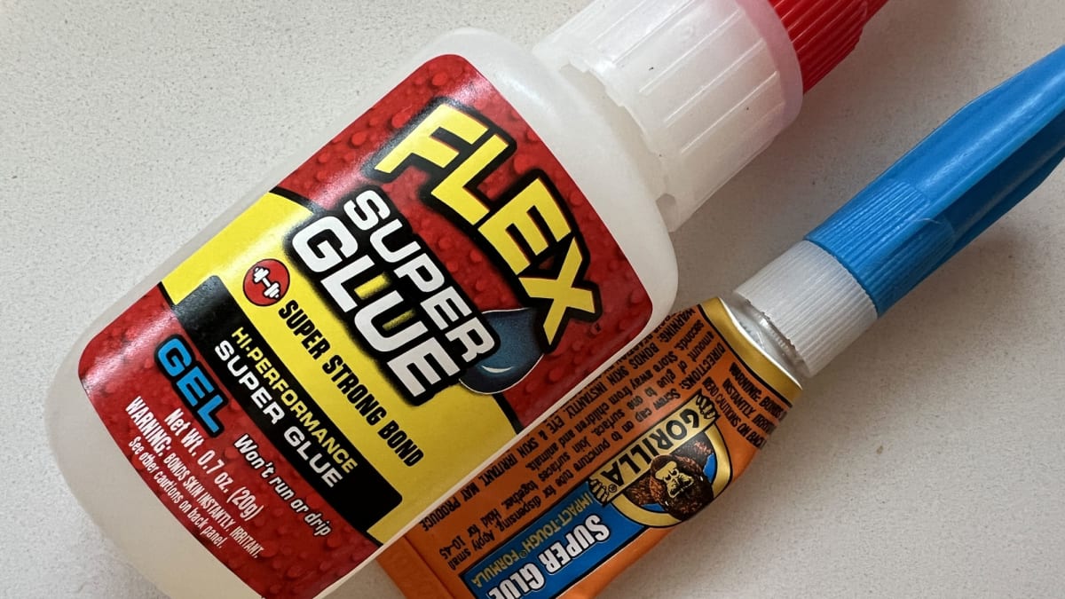 Why do super glue store adhesives bond to skin