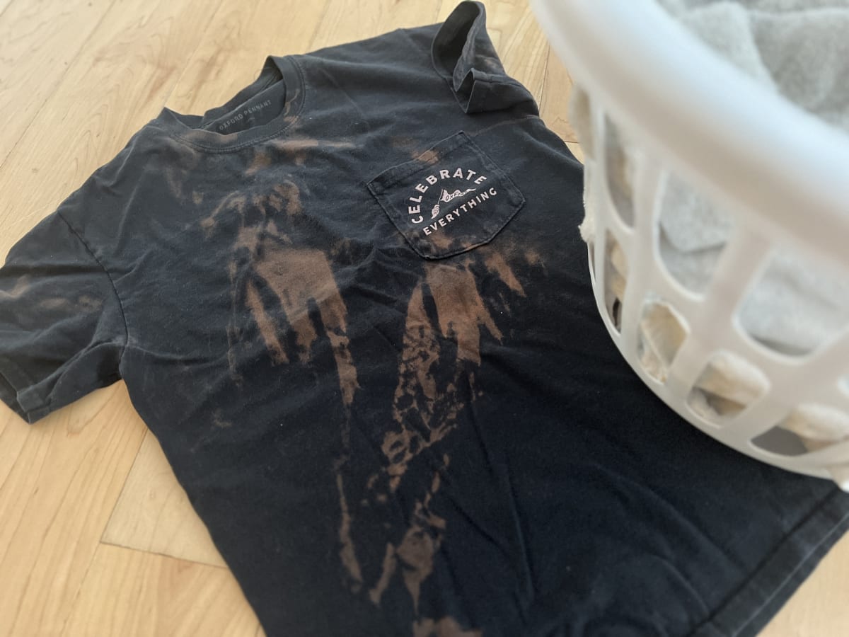 How to get bleach stains out of black clothes #theironingqueen #laundr, how to get bleach out of clothes