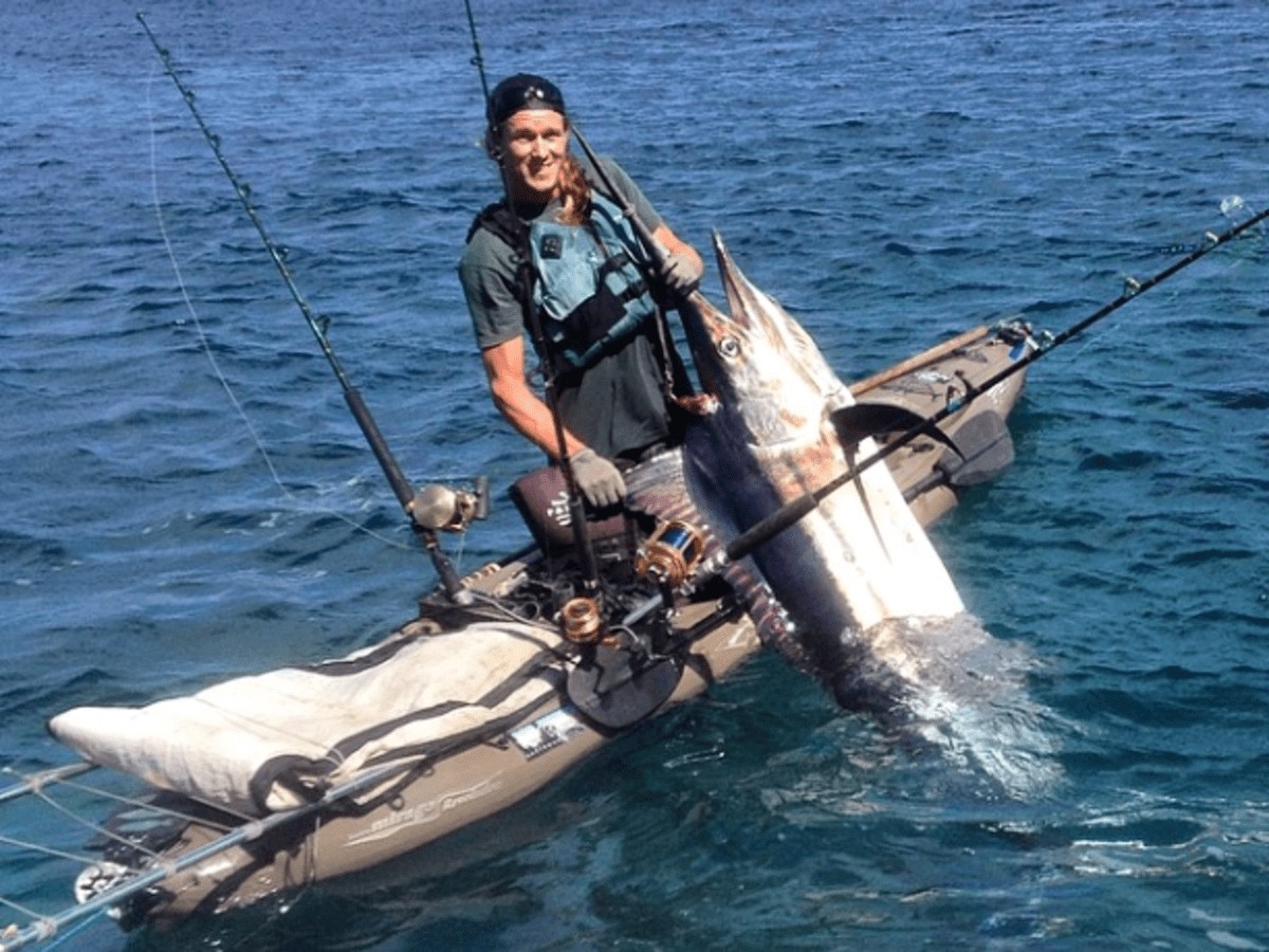 Kayak angler tosses rod overboard, catches record marlin - Men's Journal