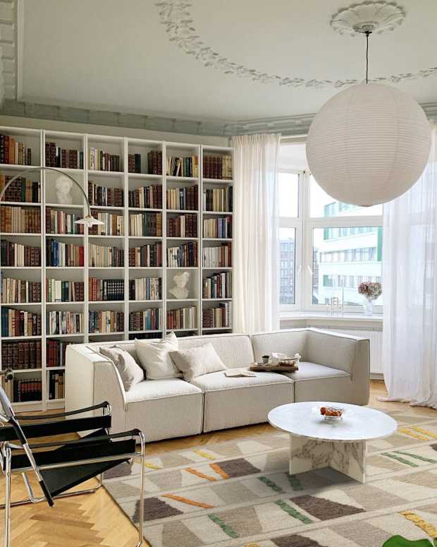 Book rug in a home living room or library makes a statement in a 1960's inspired space.