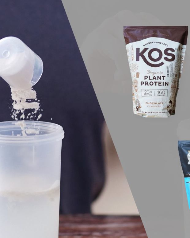 A hand putting white protein powder into a clear shaker bottle full of water on the right, a brown and white pack of KOS plant protein, a black and brown container of jacked factory authentic vegan protein, and a blue and black bag of legion plant + protein, three of our picks for the best vegan protein powder