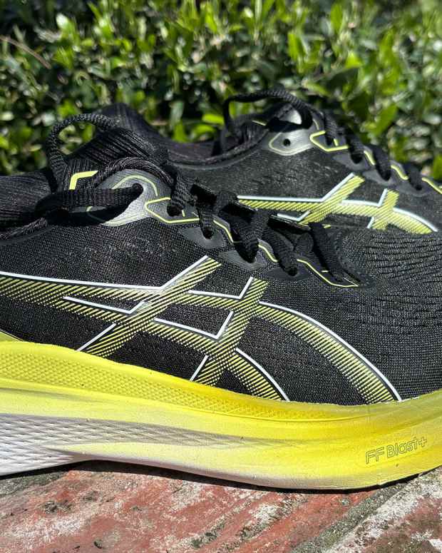 Black, yellow, and white Asics Gel-Kayano 30 is among the best Asics running shoes for stability