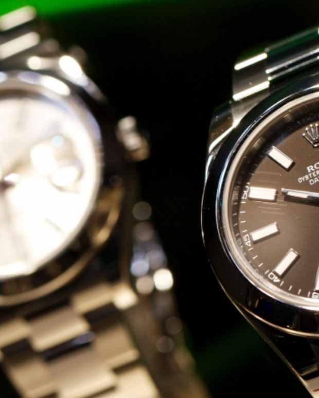 "Oyster Perpetual Datejust" wristwatches, manufactured by Rolex, sit on during the Baselworld watch fair in Basel, Switzerland, on Wednesday, March, 7, 2012. 