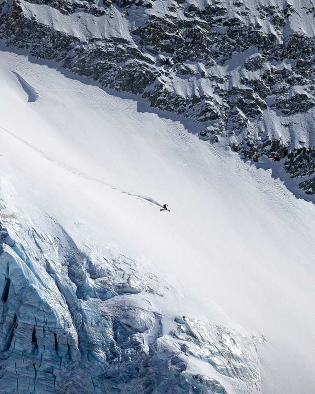 Solo skier on a steep untracked couloir in La Grave, France