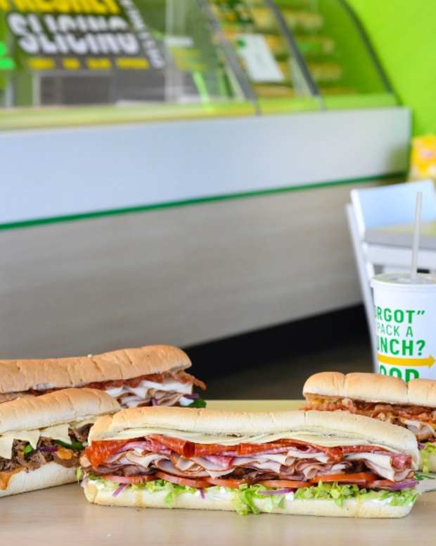 Photo of a Subway restaurant interior with sandwiches, sandwich artist images, other menu item images on December 19, 2023 in Crystal River, Florida.