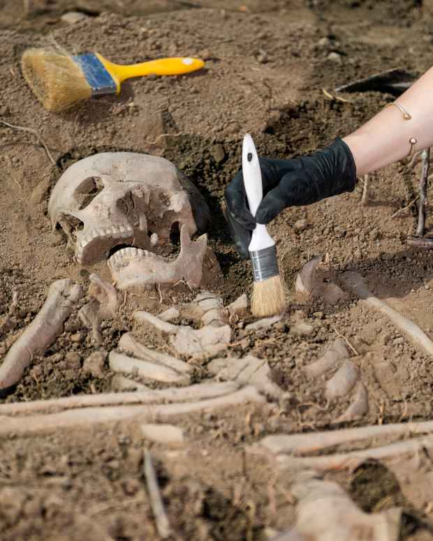 Archaeological excavations. Human skeleton remains found in an ancient tomb.