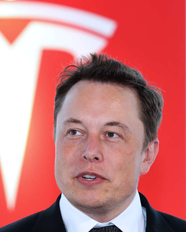Elon Musk, co-founder and chief executive officer of Tesla Motors Inc., attends a key delivery ceremony of the company's premium electric sedan Model S vehicles to customers in Tokyo, Japan, on Monday, Sept. 8, 2014. Tesla may partner with Toyota Motor Corp. again in the future, Musk said. Photographer: Yuriko Nakao/Bloomberg via Getty Images 