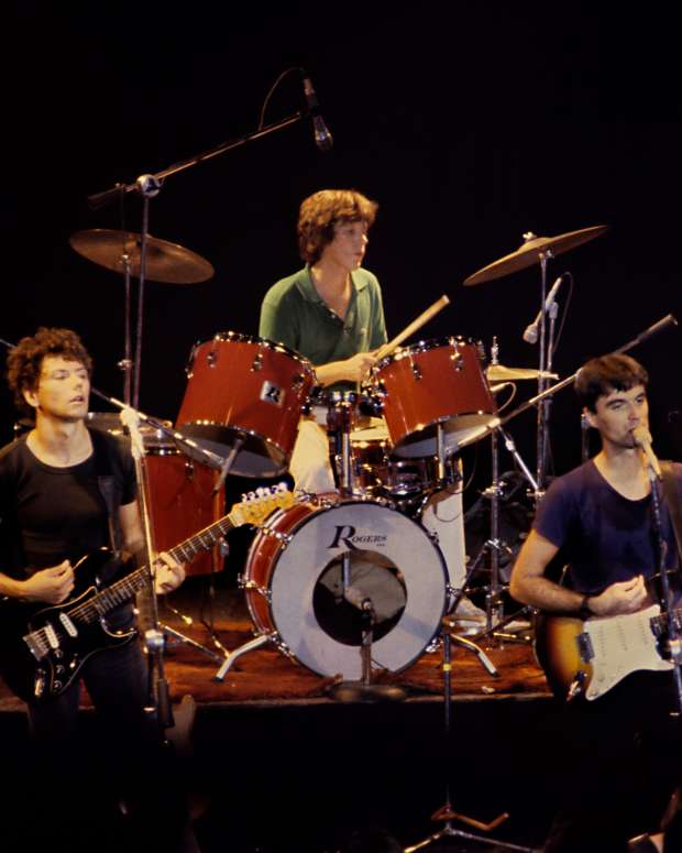 (L-R) Guitarist Jerry Harrison, drummer Chris Frantz, guitarist and lead vocalist David Byrne and bassist Tina Weymouth of Talking Heads perform at The Agora Ballroom on October 7, 1978 in Atlanta, Georgia. (Photo by Tom Hill/Getty Images)