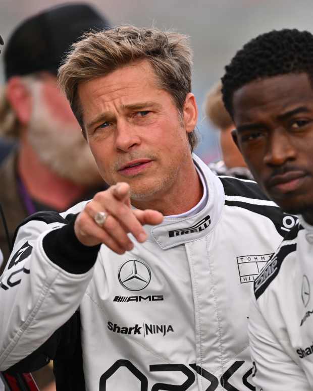 NORTHAMPTON, ENGLAND - JULY 09: Brad Pitt, star of the upcoming Formula One based movie, Apex, and Damson Idris, co-star of the upcoming Formula One based movie, Apex, look on from the grid during the F1 Grand Prix of Great Britain at Silverstone Circuit on July 09, 2023 in Northampton, England. (Photo by Dan Mullan/Getty Images) 