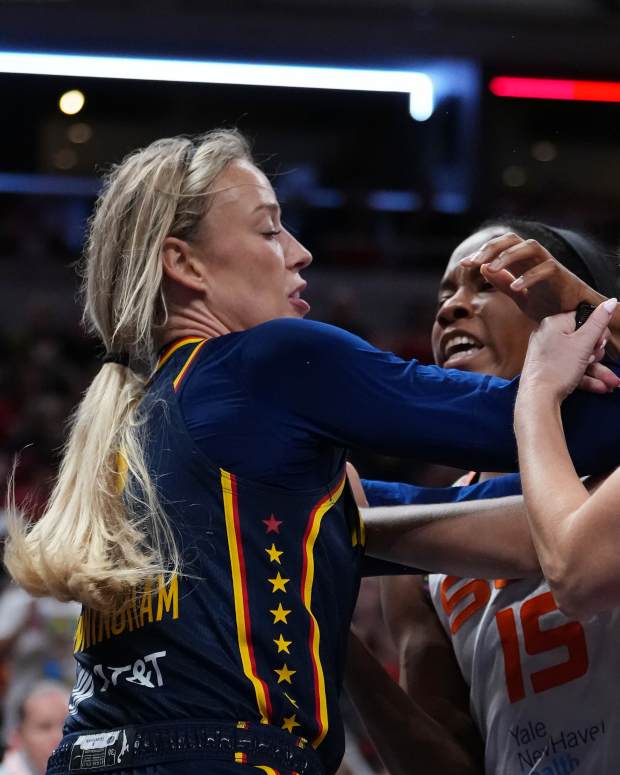 INDIANAPOLIS, INDIANA - JUNE 17: Sophie Cunningham #8 of the Indiana Fever and Jacy Sheldon #4 of the Connecticut Sun face off during an altercation in the fourth quarter at Gainbridge Fieldhouse on June 17, 2025 in Indianapolis, Indiana. NOTE TO USER: User expressly acknowledges and agrees that, by downloading and or using this photograph, User is consenting to the terms and conditions of the Getty Images License Agreement. (Photo by Dylan Buell/Getty Images)