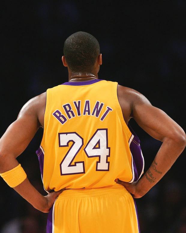 LOS ANGELES, CA - MARCH 30:  Kobe Bryant #24 of the Los Angeles Lakers looks on during a freethrow in the first half against the Houston Rockets at Staples Center on March 30, 2007 in Los Angeles, California.  NOTE TO USER: User expressly acknowledges and agrees that, by downloading and or using this Photograph, user is consenting to the terms and conditions of the Getty Images License Agreement.  (Photo by Lisa Blumenfeld/Getty Images)