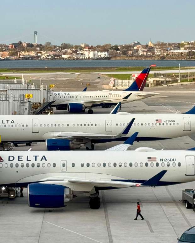 Delta airlines passengers planes, Airbus A220-100 (front) and Airbus A321-211 (second) sit at LaGuardia airport, in New York City, on April 18, 2025.