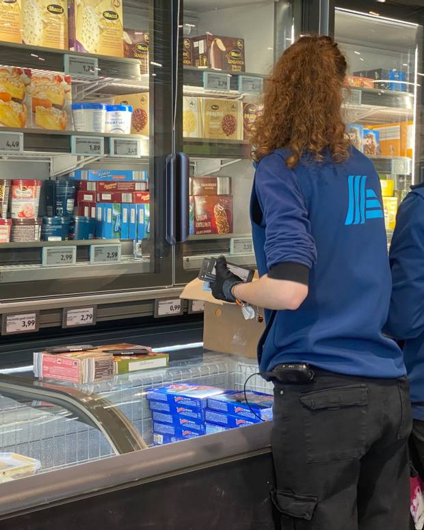 Aldi freezer aisle with workers