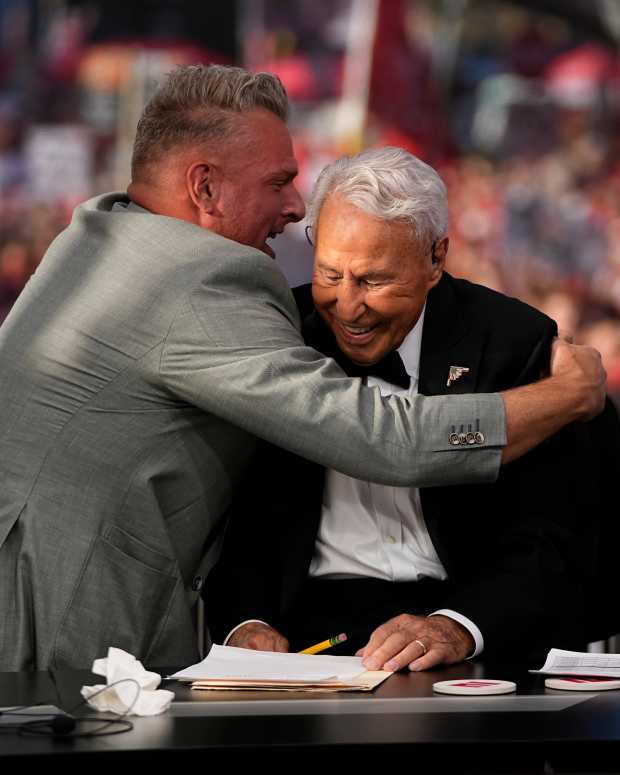 Pat McAfee hugs Lee Corso on the "College GameDay" set.