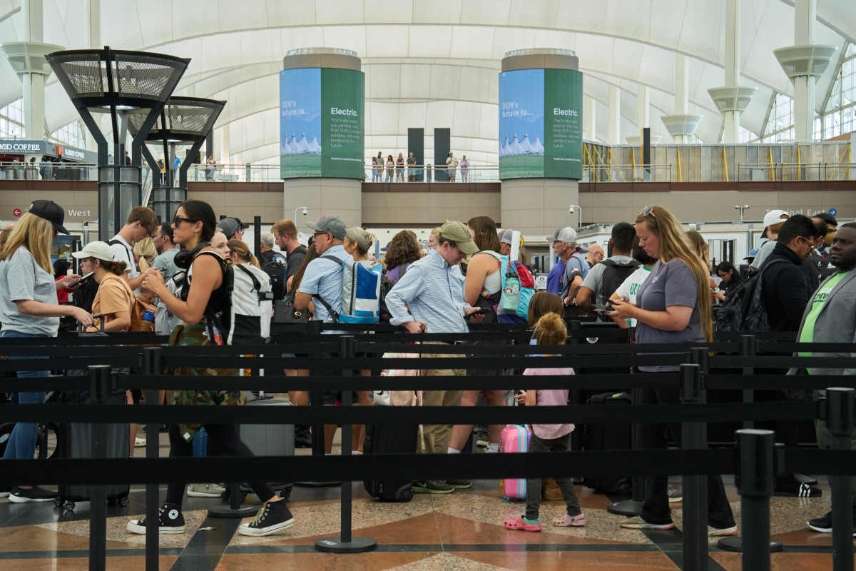 Travelers at airport security