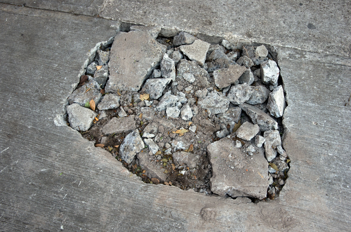 Watch What Happens When This Busy City Sidewalk Collapses