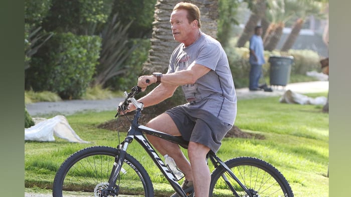 arnold schwarzenegger riding bike