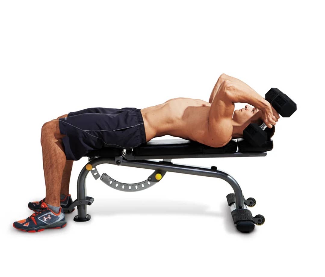Best Dumbbell Back Exercises: Shirtless caucasian man on a bench doing skull crusher with dumbbells