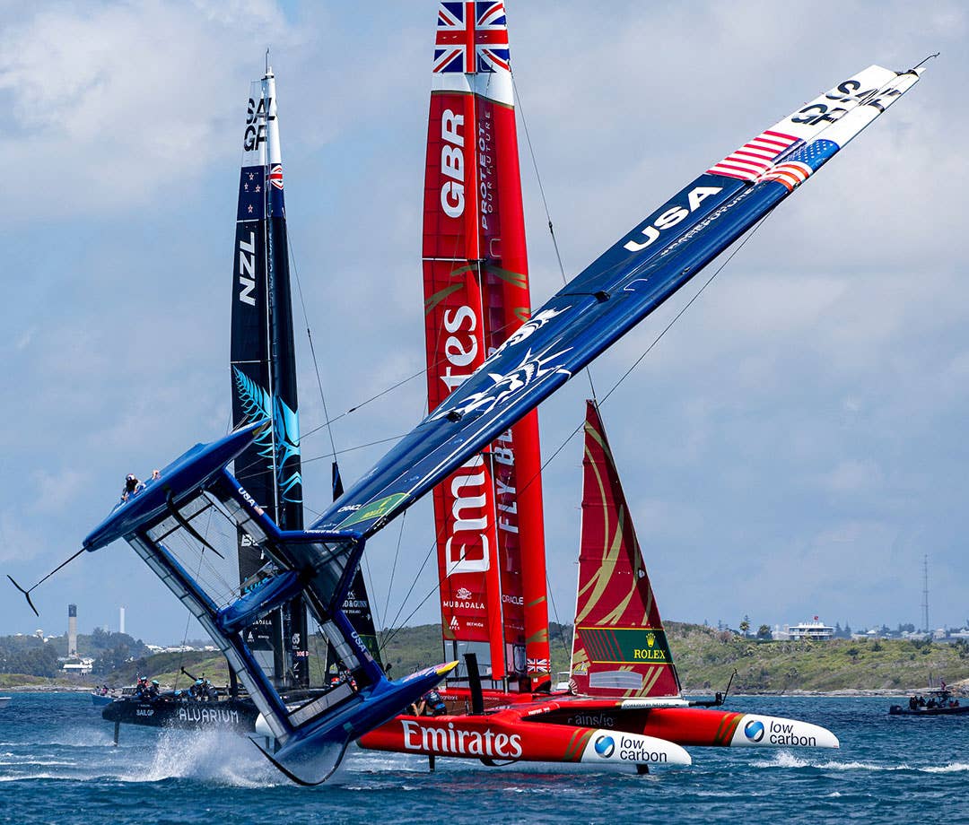 SailGP boats racing in Bermuda. U.S. boat keeling hard.