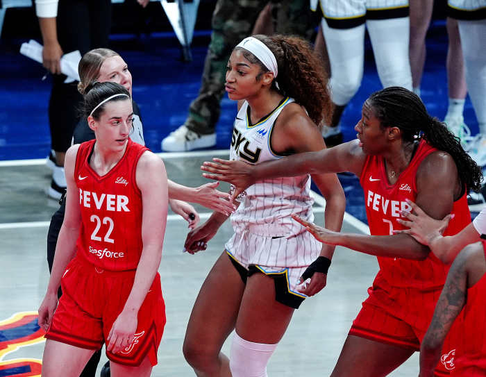 INDIANAPOLIS, IN - MAY 17: Chicago Sky forward Angel Reese (5) reacts after being fouled by Indiana Fever guard Caitlin Clark (22) as Indiana Fever forward Aliyah Boston (7) tries to separate Reese (5) from Clark (22) on May 17, 2025, at Gainbridge Fieldhouse in Indianapolis, Indiana. (Photo by Brian Spurlock/Icon Sportswire via Getty Images)