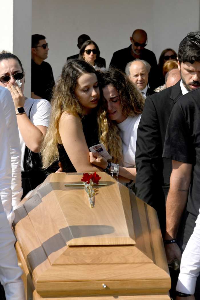 Diogo Jota's wife Rute Cardoso (C,R) and her sister react as former teammates carry the coffin during the funerals of Liverpool's Portuguese forward Diogo Jota and his brother Andre Silva at the Mother Church of Gondomar, on the outskirts of Porto, on July 5, 2025.