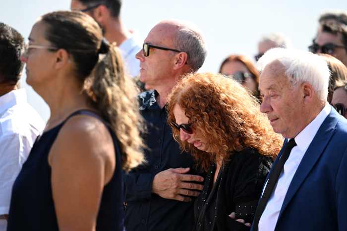 Joaquim Silva, Father of Diogo Jota And Andre Silva, consoles Isabel Silva, Mother Diogo Jota And Andre Silva, as they arrive in the procession at a funeral held for Diogo Jota and his brother Andre Silva at Igreja Matriz de Gondomar on July 05, 2025 in Gondomar, Portugal.