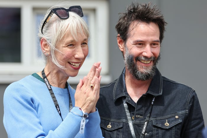 HOHENSTEIN-ERNSTTHAL, GERMANY - JULY 7: Keanu Reeves and Alexandra Grant during the MotoGP of Germany at Sachsenring Circuit on July 7, 2024 in Hohenstein-Ernstthal, Germany. (Photo by Qian Jun/MB Media/Getty Images)