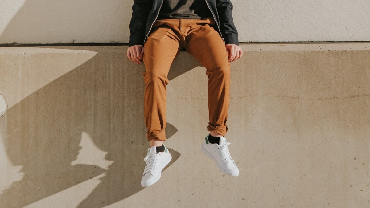 These solid-colour slim-fit trousers come in polywool fabric with belt  loops, side pockets and an off-centre fastening.