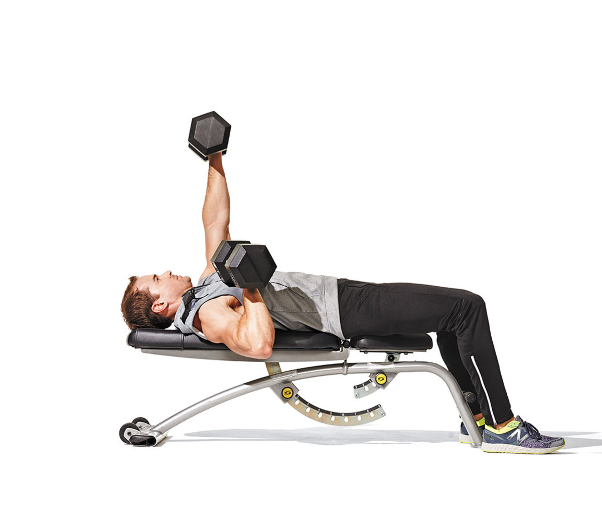 Young Man Use Dumbbell Exercises Chest Fly on Yoga Mat in Living