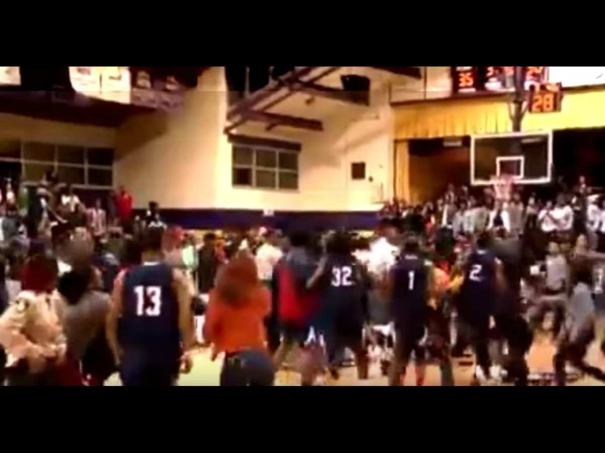 Watch College basketball game spirals into wild, chairslamming brawl