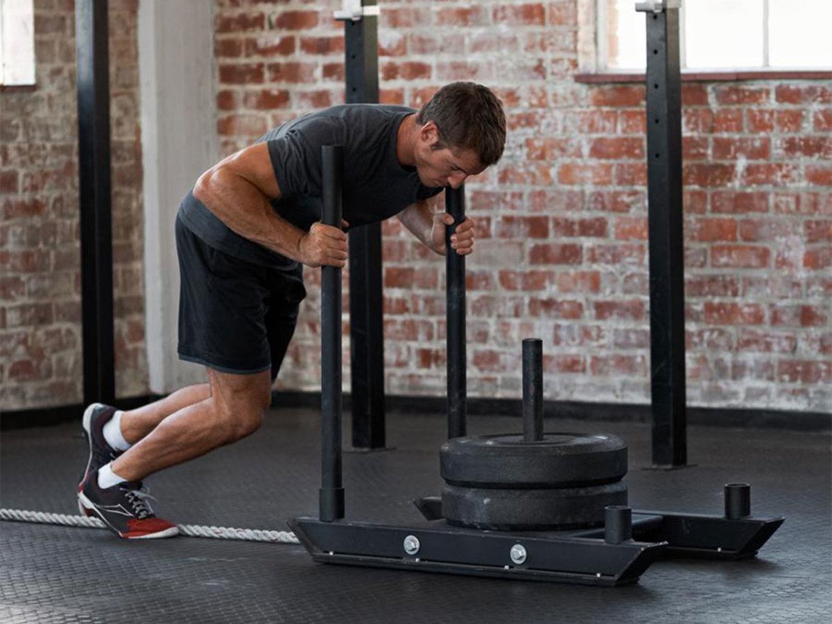 10 Sled Exercises That Train Your Entire Body Men s Journal