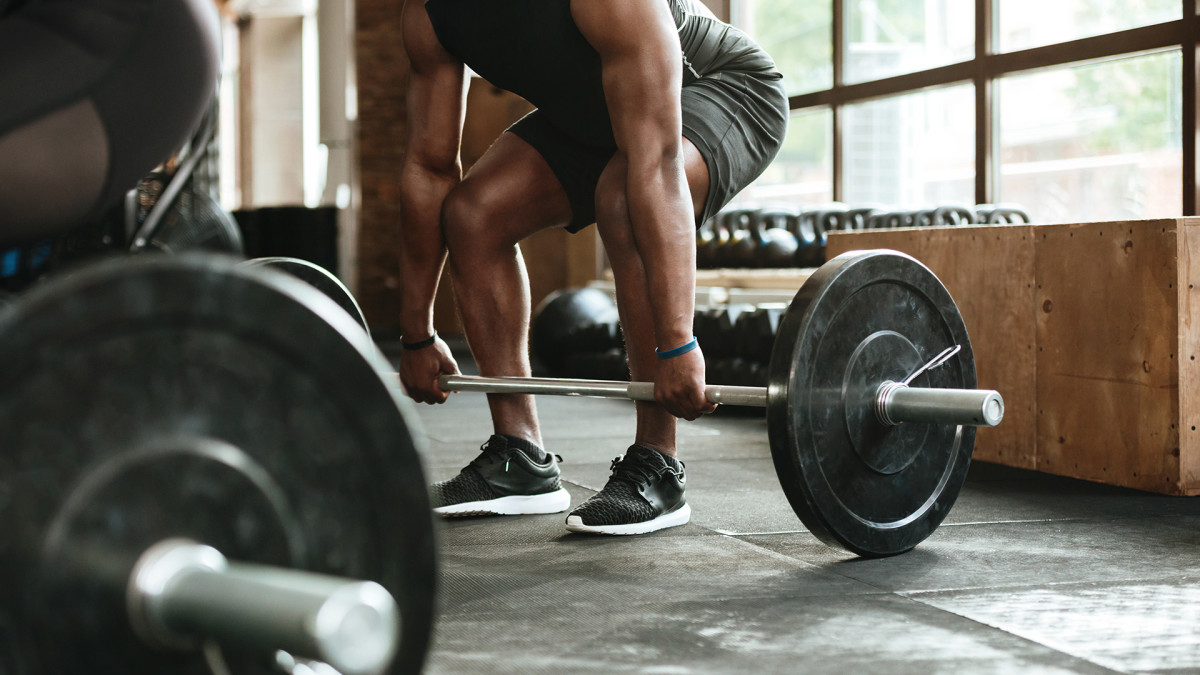 Lifting Weights Can Lower Your Risk of Colon Cancer, Study Finds Men