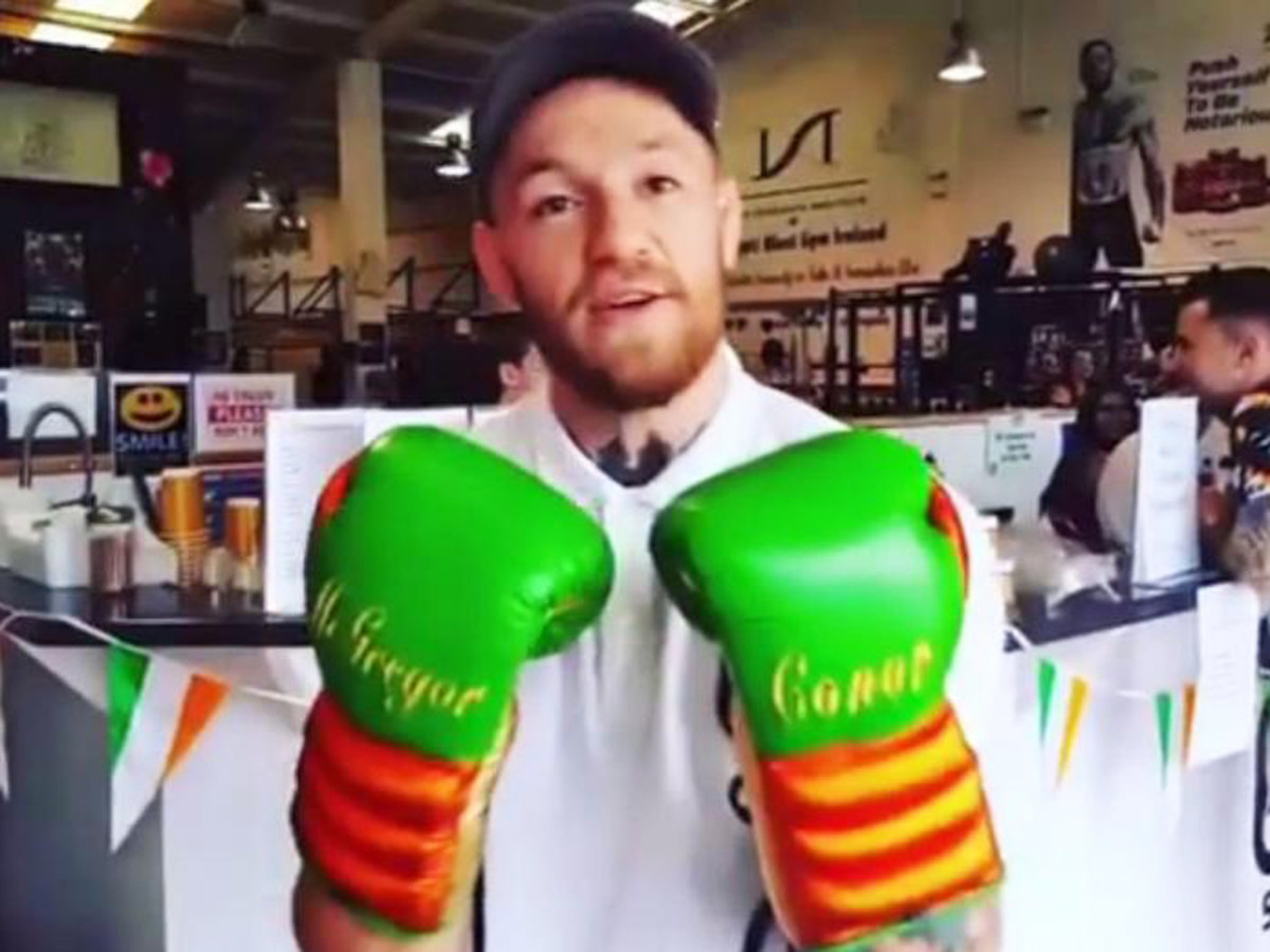 Conor McGregor tries new "Ireland" boxing gloves Men's Journal
